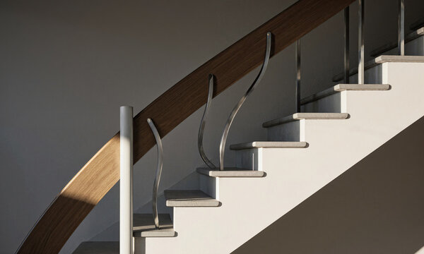 Staircase banister interior featuring a modern wooden handrail and elegant curved metal balusters in a minimalist contemporary home design