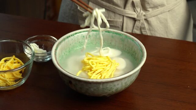 Garnishing Tteokguk with Egg Strips
