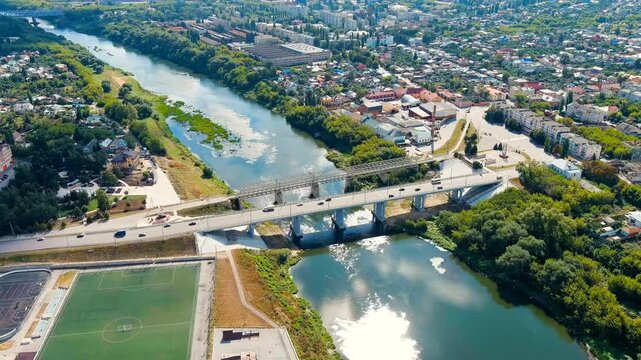 Yelets, Lipetsk region, Russia. Karakum automobile and pedestrian bridges. Sosna river. Historic city center. Drone footage
