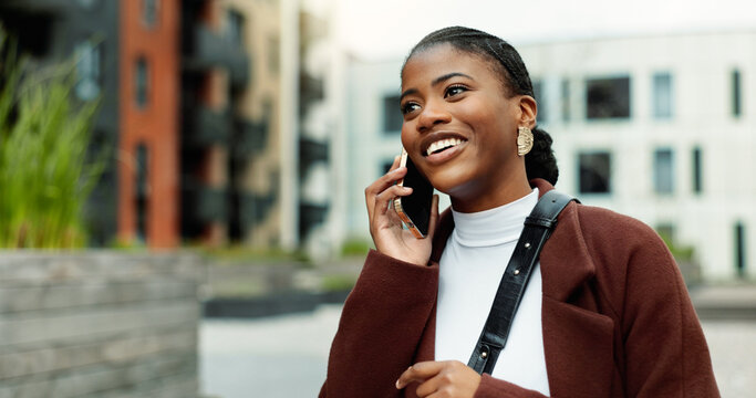 Contact, business or black woman with phone call in city, settlement offer negotiation or case update. Space, consulting client or lawyer with tech for trial arrangement, smile or billing discussion