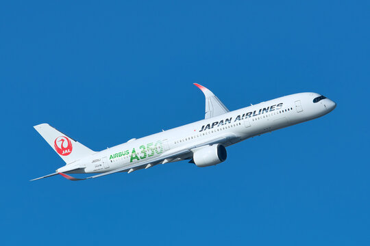 Japan Airlines (JAL) Airbus A350-900 (JA03XJ) passenger plane banking right after takeoff from Haneda Airport, Tokyo, Japan