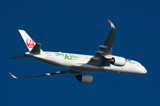 Japan Airlines (JAL) Airbus A350-900 (JA03XJ) passenger plane in steady level flight after departing Haneda Airport, Tokyo, Japan