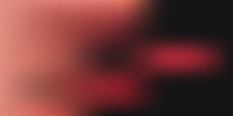 Obraz premium Abstract Cinematic Film Grain Texture with Red Light Leaks and Soft Blurred Glow on Black Background