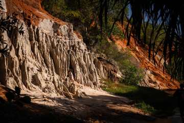 Fototapeta premium Stunning Eroded Landscape with Unique Geological Formations and Greenery