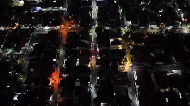Top down aerial view of a vibrant painted basketball court in an urban area.