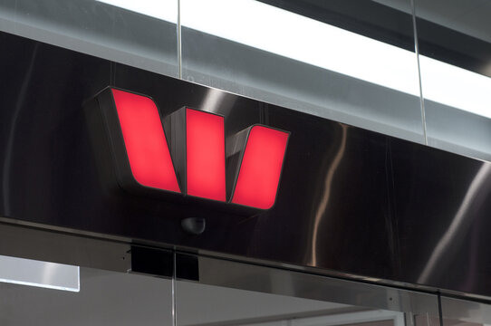 Illuminated Westpac Bank sign at building in Brisbane, Australia