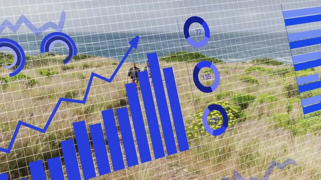Couple walking dunes, data feed sparking gauges and charts covering pair, showing coastal metrics
