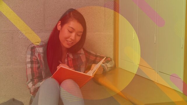 Student opening orange notebook at school studying notes and turning pages with overlays animating