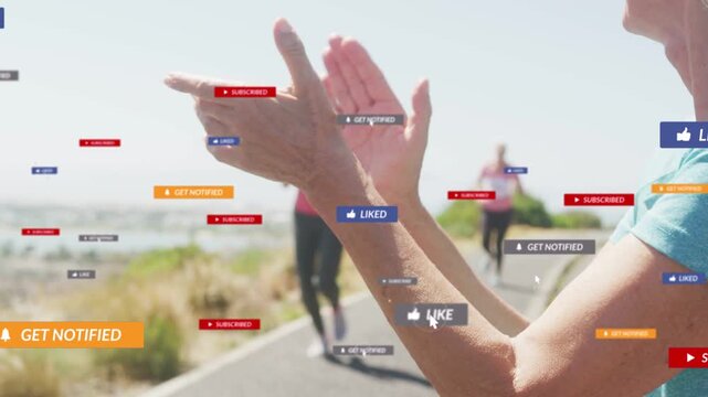 Woman clapping, cheering, generating social icons as runner with bib 1203 passing for marketing