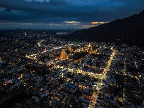 Aerial night view of the historic Annamalaiyar Temple and Tiruvannamalai city, Tamil Nadu, India.