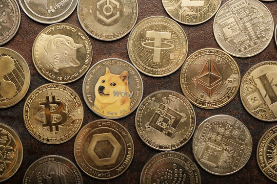 Various Cryptocurrencies Arranged on a Surface Showing Different Designs and Symbols