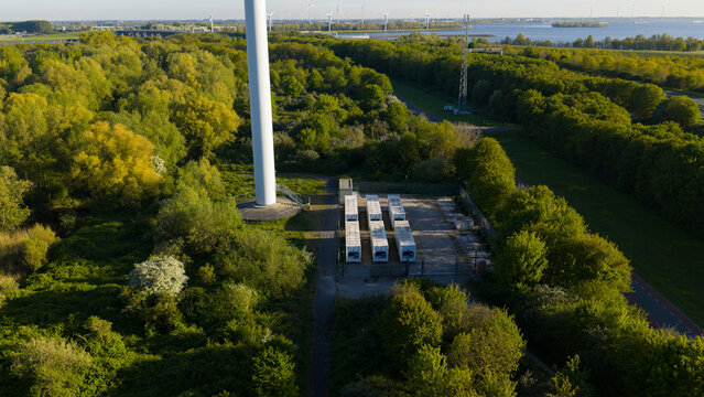 Drone view of a stationary energy storage system near Hellegatsplein wind farm, used for grid balancing, FCR, imbalance control, and renewable power storage.