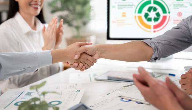 Business handshake for sustainability and green energy project agreement in office.