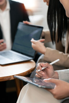 Business people working together using digital tablet and laptop in office.