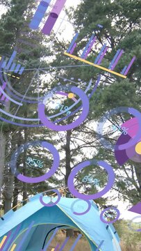 Vertical video: Camera tilting, AR rings sweeping canopy and tent, revealing gear for camp status