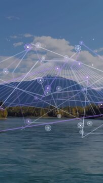 Vertical video: Faint dots starting grid growing over peak linking nodes and lines showing network