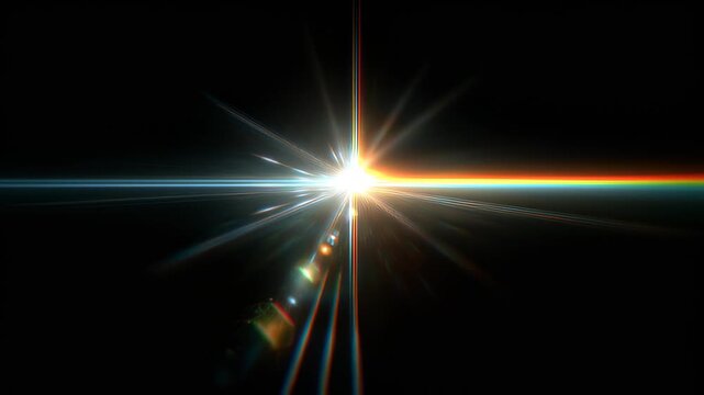 Bright light shines in dark background and creates colorful lines and patterns