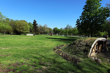 A clearing in the park with a playhouse © Alex