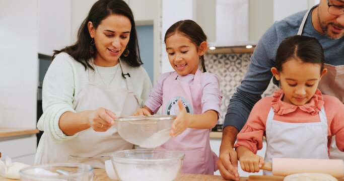 Happy, family and baking with children in kitchen, growth and learning culinary skills with parents. Teaching, kids and help with dessert preparation, development and people with ingredients in house
