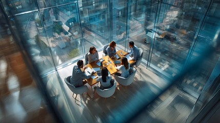 Obraz premium Diverse Gen Z team collaborating in modern glass-walled office with city view, high-angle shot