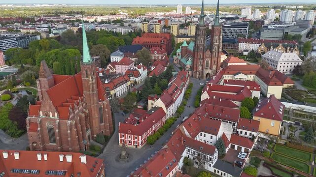Aerial Hyperlapse view drone flying over Wroclaw touristic city center, islands and Odra river at sunny summer day