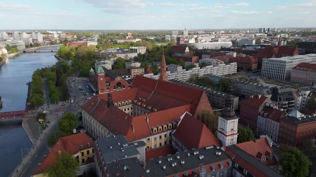 Aerial view drone flying over Wroclaw touristic city center, churches, islands and Odra river at sunny summer day