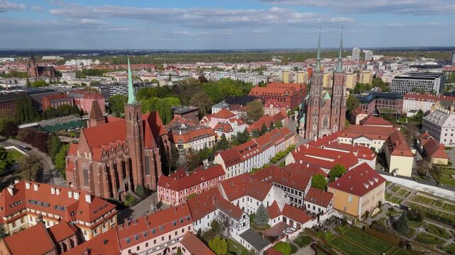 Aerial view drone flying over Wroclaw touristic city center, churches and cathedrals on Odra river islands at sunny summer day