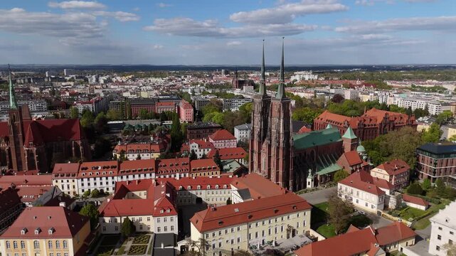 Aerial view drone flying over Wroclaw touristic city center, churches and cathedrals on Odra river islands at sunny summer day