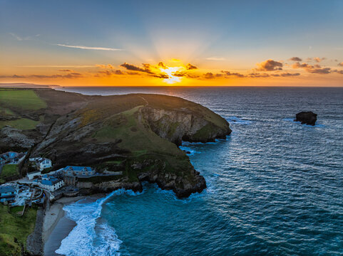 Sunset over sea and cliffs from a drone, Portreath, Redruth, Cornwall, England
