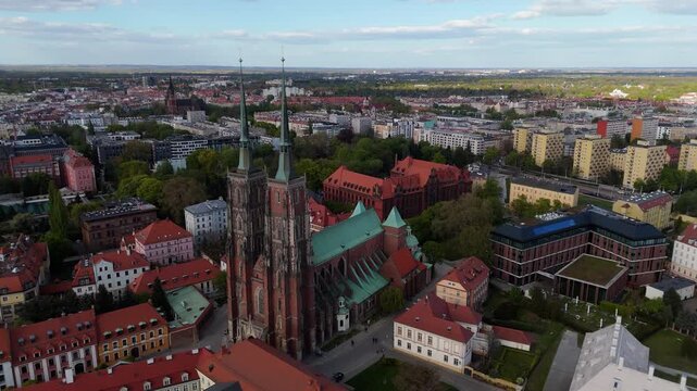 Aerial view drone flying over Wroclaw touristic city center, churches and cathedrals on Odra river islands at sunny summer day