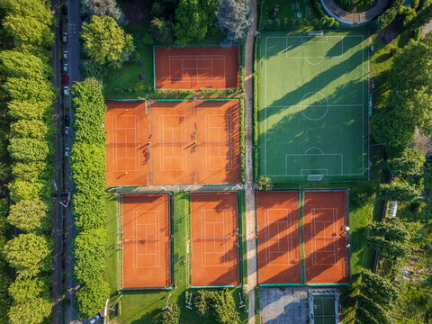 Aerial view of the Circolo della Stampa - Sporting tennis courts and football pitch surrounded by green trees in Torino, Piemonte, Italy.