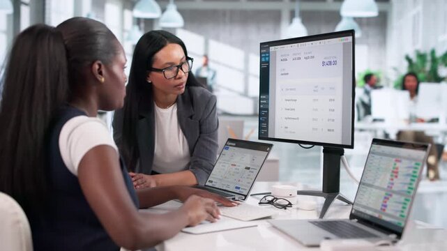 Young Women Focused On Payroll Data