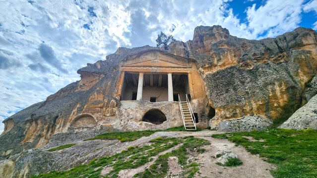 Gerdekkaya Monumental Tomb in the Phrygian Valley, featuring a rock-cut Doric-style temple front with a triangular pediment and massive columns, reflecting strong Hellenistic architectural influence