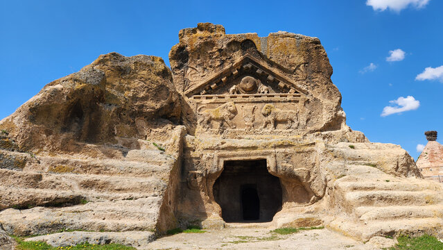 In Eskişehir, Turkey, the Solon&rsquo;s Tomb (Lion Temple) in Phrygian Valley, showing its rock-cut fa&ccedil;ade with Roman-era lion reliefs beneath a triangular pediment featuring symbolic motifs