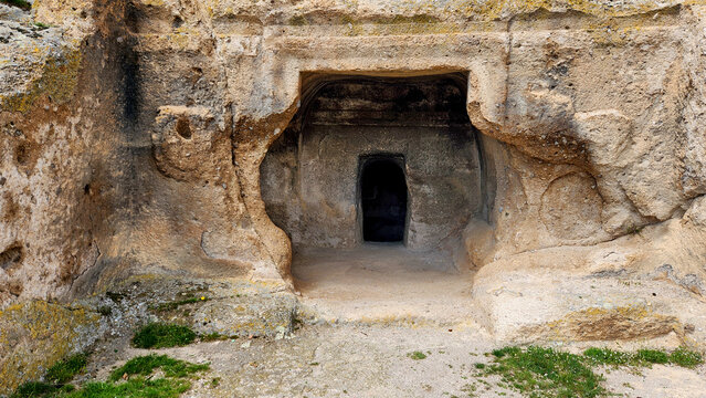 Solon&rsquo;s Tomb (Lion Temple) in the Phrygian Valley, showing its monumental rock-cut entrance carved into volcanic tuff, with a structured frame and a dark inner passage leading into the burial chamber