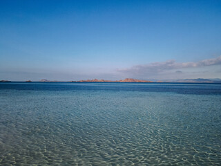Taka Makassar Crescent Sandbar with Crystal Clear Turquoise Water in Komodo National Park © Wahde Stock
