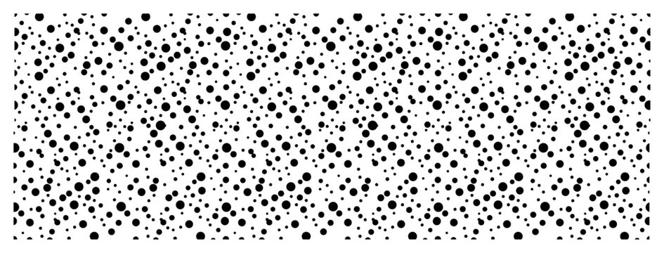 Randomly distributed dots and spots creating a minimalist stipple texture pattern