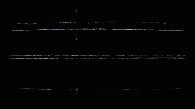 Multicolored noise pattern on black background resembling TV static in abstract style
