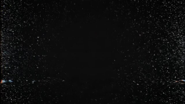 Dense cluster of small white particles scattered unevenly on a black background, resembling a starry sky