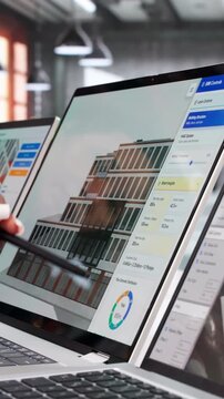 Engineers Collaborate On Laptop Designing Sustainable HVAC System