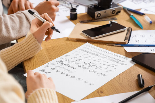 Young people during courses of calligraphy