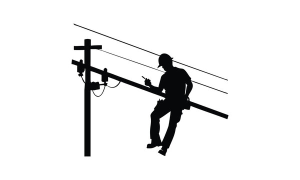 Silhouette of lineman working on power pole