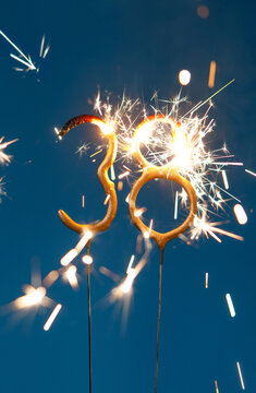 38 years celebration festive background made with Bengal fires in the form of number Thirty eight. Vertical photography.