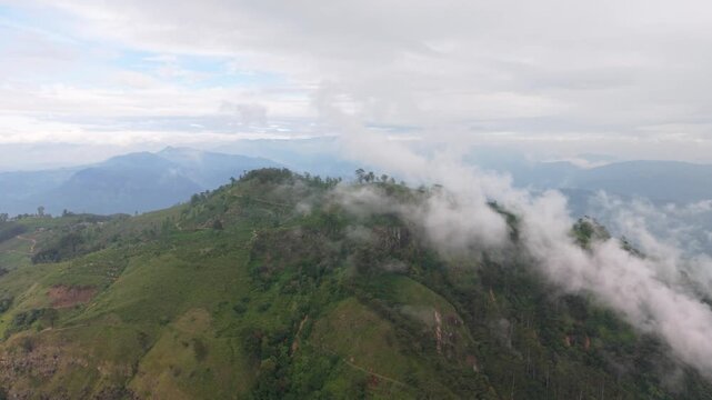 Low Clouds Over Peaks Of Narangala Mountain In The Badulla District Of Sri Lanka. Aerial Wide Shot