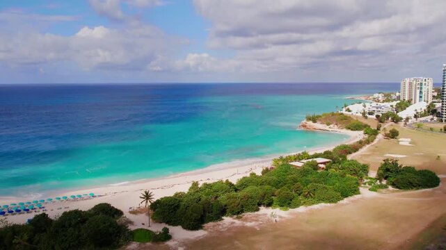 Drone footage of the vibrant coral ecosystems visible through the water at David's Hole.
