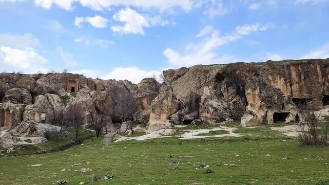 The Meme&ccedil; Rock Settlement in Phrygia is an ancient site featuring multi-story dwellings, chambers, and storage rooms carved directly into soft volcanic tuff rocks.