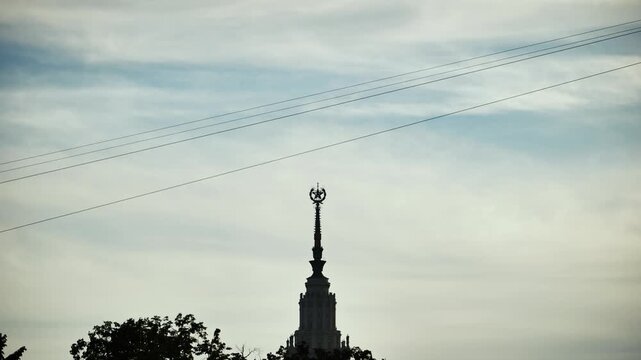 Person ziplining over Moscow State University in Russia, adventure and recreation concept