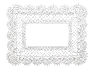 Delicate white crochet rectangular doily with ornate lacy border. © RK graphics