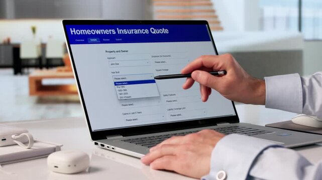 Man Filling Home Owner Insurance Quote Form