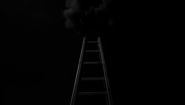 A black and white photo of a ladder in a dark environment, great for use as a mystery or suspense background